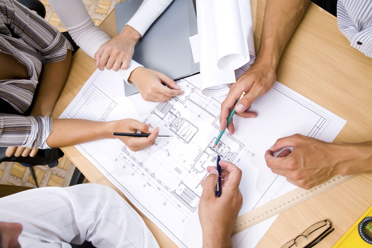 Concept drawings being sketched on a table